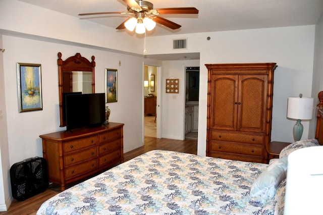 5300 S Atlantic Ave Unit 8-402, New Smyrna Beach, FL 32169 - bedroom with baseboards, visible vents, wood finished floors, and ceiling fan