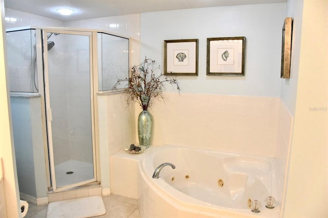 5300 S Atlantic Ave Unit 8-402, New Smyrna Beach, FL 32169 - full bathroom featuring a stall shower, tile patterned flooring, and a whirlpool tub