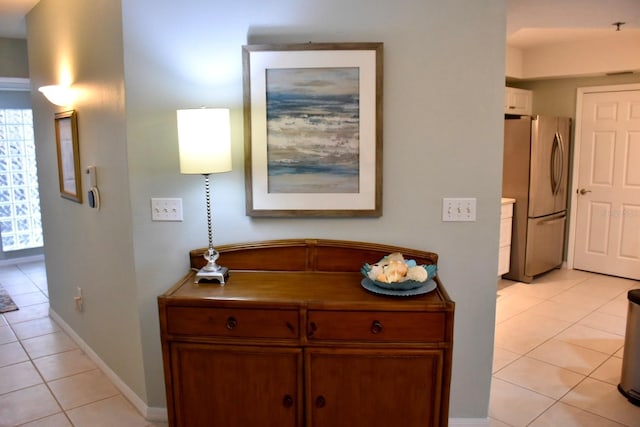 5300 S Atlantic Ave Unit 8-402, New Smyrna Beach, FL 32169 - hallway with baseboards and light tile patterned flooring