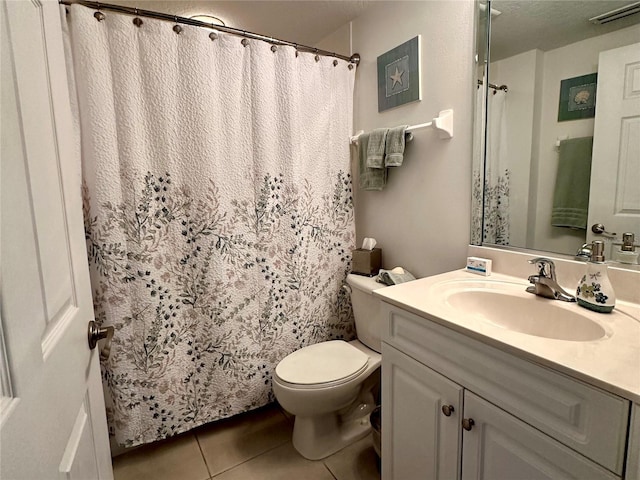 5300 S Atlantic Ave Unit 8-402, New Smyrna Beach, FL 32169 - bathroom featuring tile patterned flooring, a shower with curtain, toilet, vanity, and visible vents