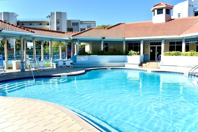 5300 S Atlantic Ave Unit 8-402, New Smyrna Beach, FL 32169 - pool featuring fence, a patio area, and french doors