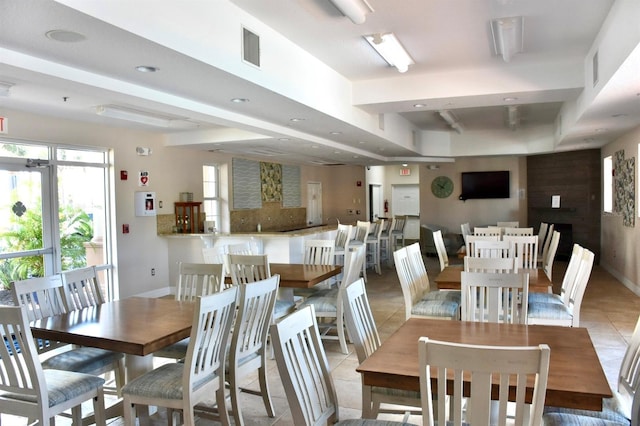 5300 S Atlantic Ave Unit 8-402, New Smyrna Beach, FL 32169 - dining room featuring visible vents, a tray ceiling, baseboards, light tile patterned flooring, and recessed lighting