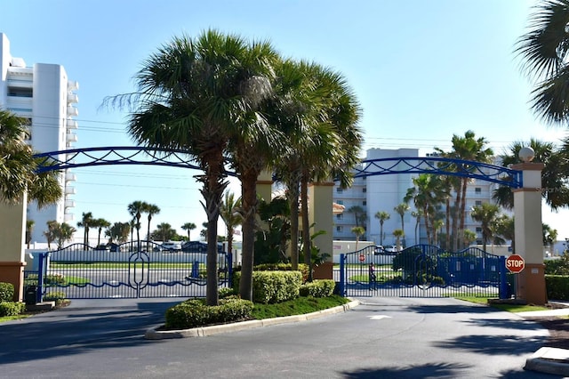 5300 S Atlantic Ave Unit 8-402, New Smyrna Beach, FL 32169 - view of street featuring traffic signs, a gated entry, and a gate