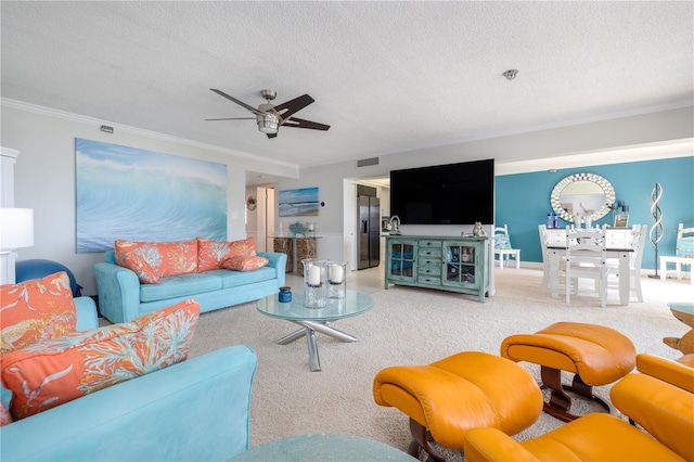4501 S Atlantic Ave Unit 415, New Smyrna Beach, FL 32169 - living room featuring light colored carpet, visible vents, a ceiling fan, a textured ceiling, and crown molding