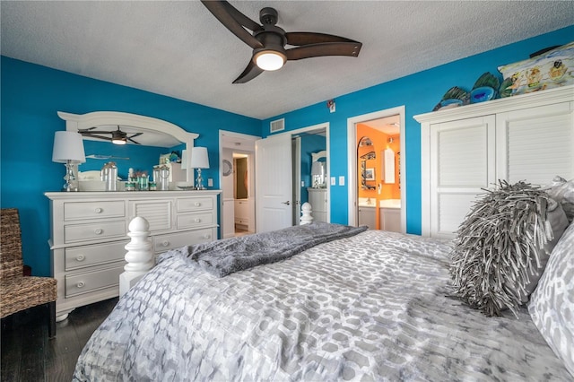 4501 S Atlantic Ave Unit 415, New Smyrna Beach, FL 32169 - bedroom featuring a textured ceiling, visible vents, wood finished floors, and a ceiling fan
