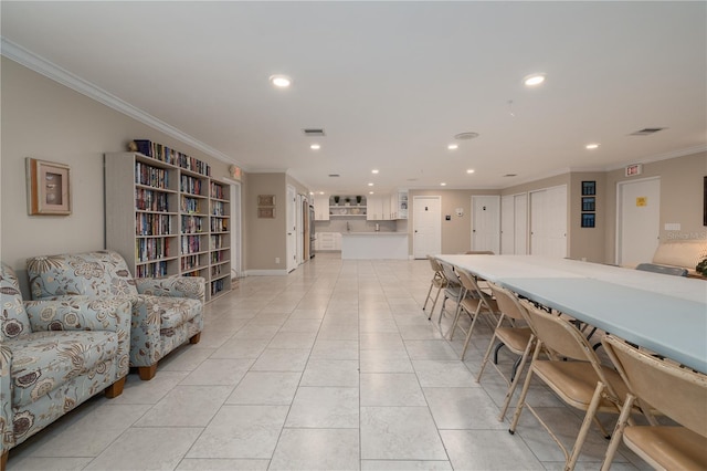 4501 S Atlantic Ave Unit 415, New Smyrna Beach, FL 32169 - dining room featuring light tile patterned floors, visible vents, recessed lighting, and ornamental molding