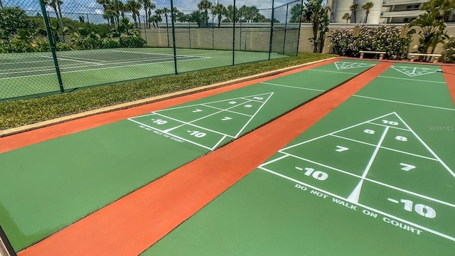 4501 S Atlantic Ave Unit 415, New Smyrna Beach, FL 32169 - surrounding community featuring fence and shuffleboard