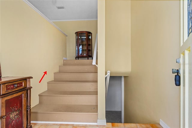 216 Dune Cir, New Smyrna Beach, FL 32169 - stairway with visible vents and crown molding