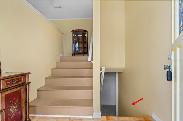 216 Dune Cir, New Smyrna Beach, FL 32169 - stairway with visible vents and crown molding