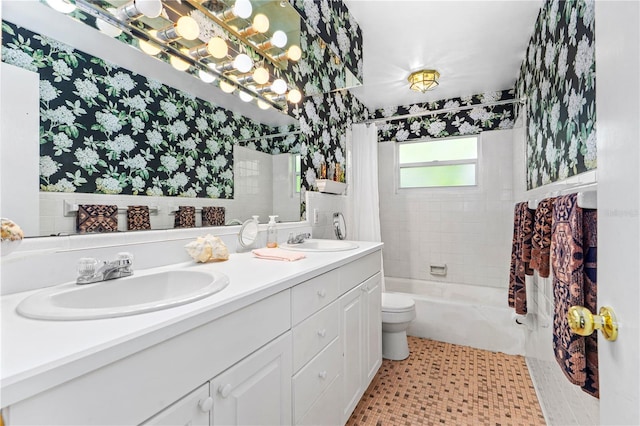 216 Dune Cir, New Smyrna Beach, FL 32169 - bathroom with double vanity, shower / tub combo with curtain, toilet, and a sink