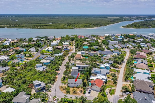 216 Dune Cir, New Smyrna Beach, FL 32169 - birds eye view of property featuring a wooded view, a water view, and a residential view