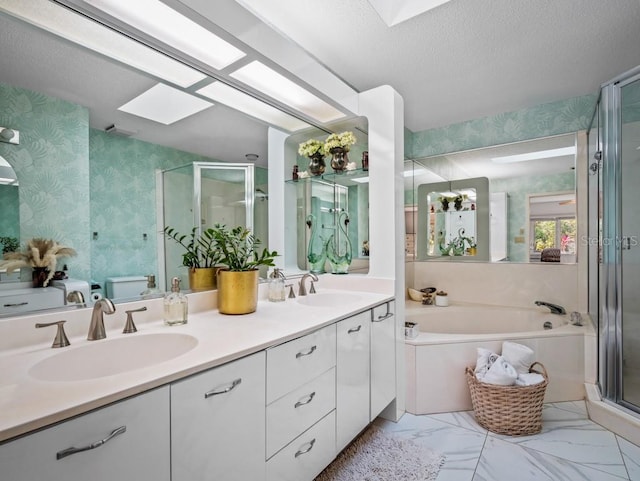 full bath featuring a skylight, wallpapered walls, and a sink