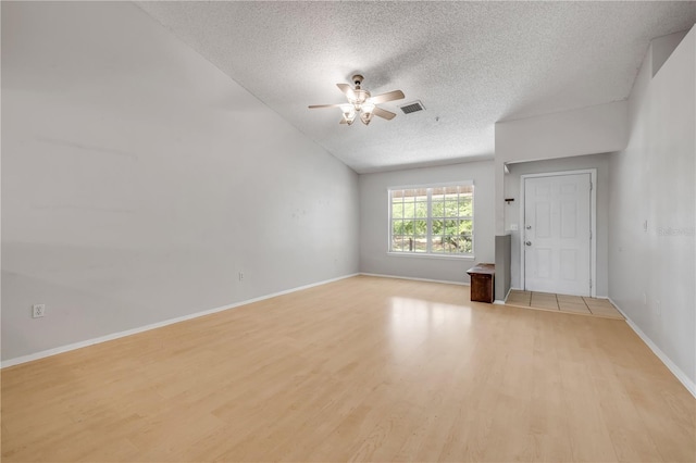 160 Reserve Cir Unit 204, Oviedo, FL 32765 - spare room featuring ceiling fan, a textured ceiling, visible vents, light wood-type flooring, and baseboards