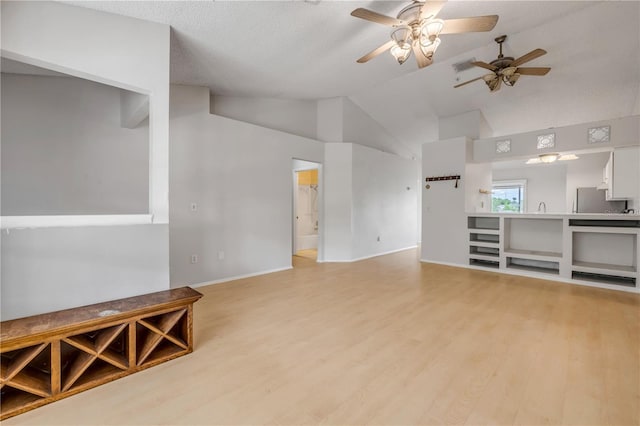 160 Reserve Cir Unit 204, Oviedo, FL 32765 - unfurnished living room with ceiling fan, baseboards, lofted ceiling, light wood-type flooring, and visible vents