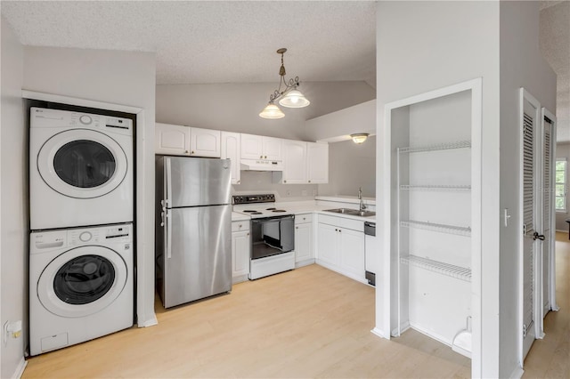 160 Reserve Cir Unit 204, Oviedo, FL 32765 - kitchen with a sink, freestanding refrigerator, white range with electric stovetop, stacked washer and clothes dryer, and under cabinet range hood