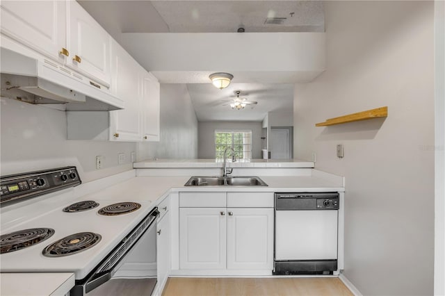160 Reserve Cir Unit 204, Oviedo, FL 32765 - kitchen featuring a sink, white appliances, light countertops, white cabinetry, and under cabinet range hood