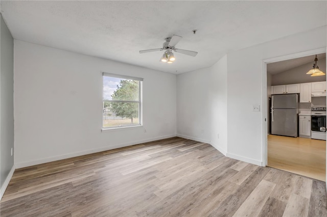 160 Reserve Cir Unit 204, Oviedo, FL 32765 - unfurnished room with baseboards, ceiling fan, and light wood-style flooring