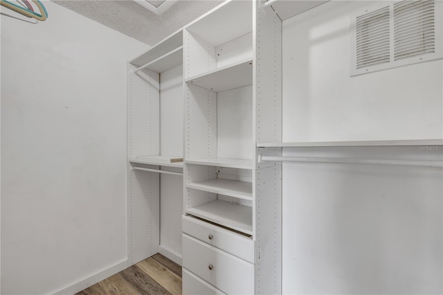 160 Reserve Cir Unit 204, Oviedo, FL 32765 - walk in closet featuring visible vents and light wood-style flooring
