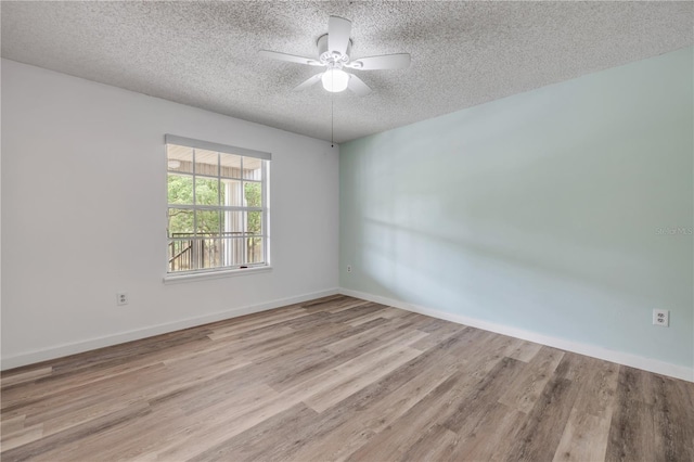 160 Reserve Cir Unit 204, Oviedo, FL 32765 - unfurnished room with baseboards, a textured ceiling, ceiling fan, and wood finished floors