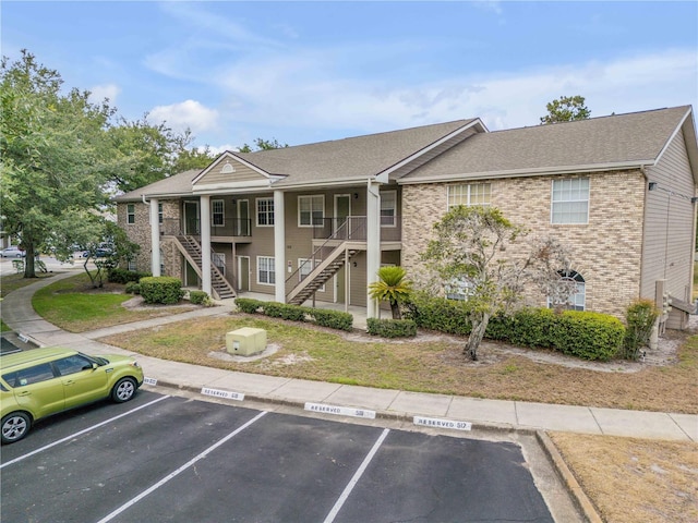 160 Reserve Cir Unit 204, Oviedo, FL 32765 - exterior space with stairs and uncovered parking