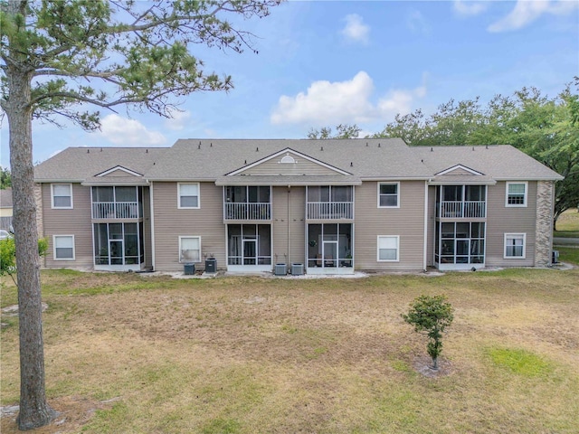 160 Reserve Cir Unit 204, Oviedo, FL 32765 - back of property with central air condition unit, a yard, and a sunroom