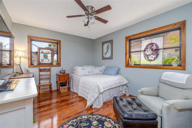 825 E 23rd Ave, New Smyrna Beach, FL 32169 - bedroom with baseboards, a ceiling fan, and wood finished floors