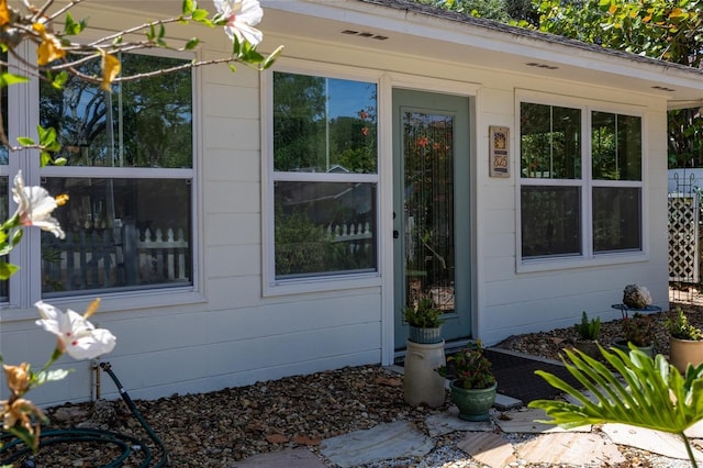 825 E 23rd Ave, New Smyrna Beach, FL 32169 - view of exterior entry featuring visible vents