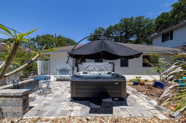 825 E 23rd Ave, New Smyrna Beach, FL 32169 - view of patio / terrace with a hot tub