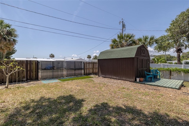 825 E 23rd Ave, New Smyrna Beach, FL 32169 - view of yard with a storage shed, an outdoor structure, and a fenced backyard