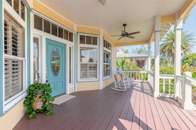 2815 Bay Side Dr, New Smyrna Beach, FL 32168 - deck featuring ceiling fan and a porch