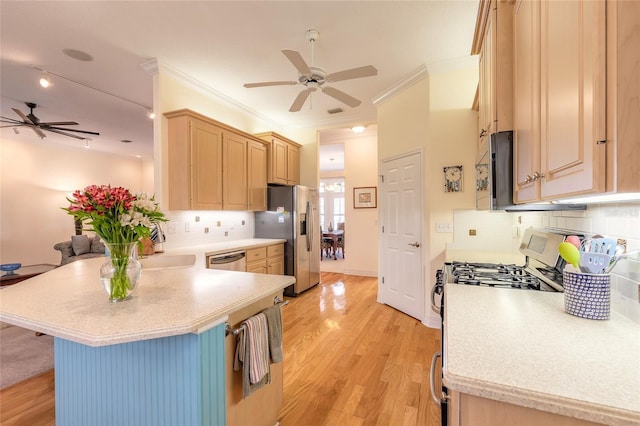 2815 Bay Side Dr, New Smyrna Beach, FL 32168 - kitchen with appliances with stainless steel finishes, light brown cabinets, a ceiling fan, and a peninsula