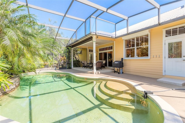 2815 Bay Side Dr, New Smyrna Beach, FL 32168 - rear view of property with an outdoor pool, a patio area, and a lanai
