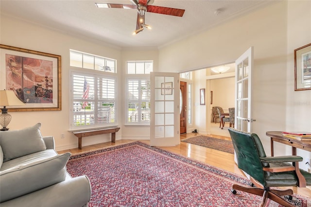 2815 Bay Side Dr, New Smyrna Beach, FL 32168 - office with wood finished floors, baseboards, a ceiling fan, french doors, and crown molding