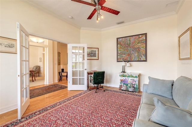 2815 Bay Side Dr, New Smyrna Beach, FL 32168 - living area with light wood-style flooring, ornamental molding, visible vents, a ceiling fan, and french doors