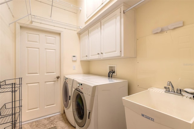 2815 Bay Side Dr, New Smyrna Beach, FL 32168 - laundry room featuring separate washer and dryer, a sink, and cabinet space