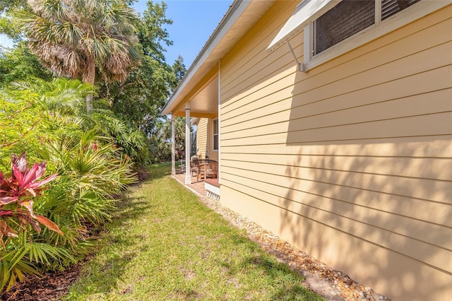 2815 Bay Side Dr, New Smyrna Beach, FL 32168 - view of side of property featuring a lawn