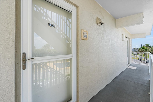 4841 Saxon Dr Unit C201, New Smyrna Beach, FL 32169 - entrance to property featuring stucco siding