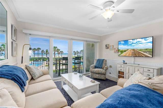 4841 Saxon Dr Unit C201, New Smyrna Beach, FL 32169 - living room with ornamental molding, wainscoting, and ceiling fan