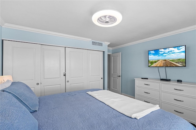 4841 Saxon Dr Unit C201, New Smyrna Beach, FL 32169 - bedroom featuring visible vents, ornamental molding, and a closet