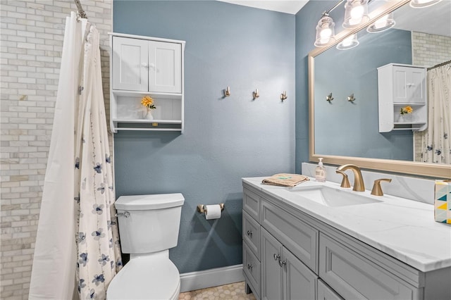 4841 Saxon Dr Unit C201, New Smyrna Beach, FL 32169 - full bath with toilet, baseboards, curtained shower, and vanity