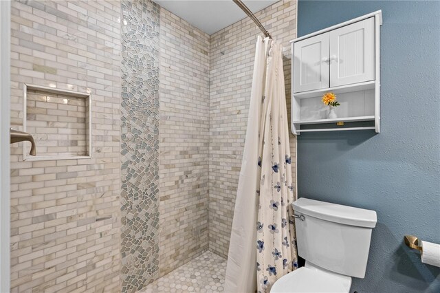 4841 Saxon Dr Unit C201, New Smyrna Beach, FL 32169 - full bathroom featuring a tile shower and toilet