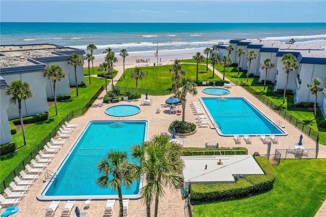 4841 Saxon Dr Unit C201, New Smyrna Beach, FL 32169 - pool featuring fence, a view of the beach, and a water view