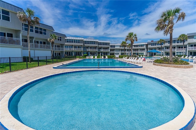 4841 Saxon Dr Unit C201, New Smyrna Beach, FL 32169 - community pool with fence