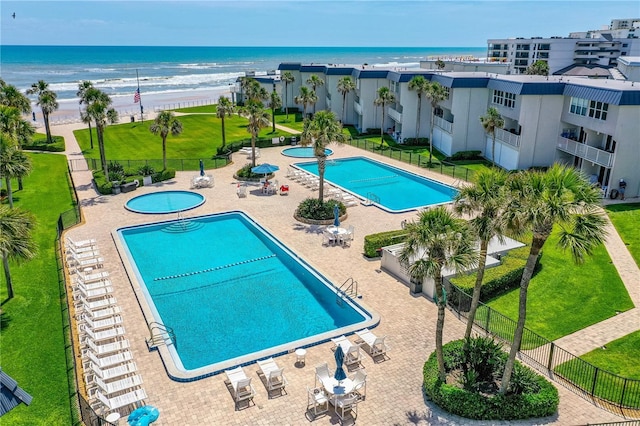 4841 Saxon Dr Unit C201, New Smyrna Beach, FL 32169 - community pool with fence, a patio, and a water view