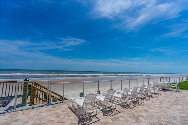 4841 Saxon Dr Unit C201, New Smyrna Beach, FL 32169 - view of patio featuring a water view and a beach view
