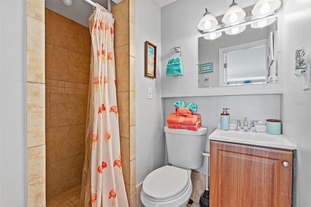 bathroom featuring toilet, a shower stall, and vanity