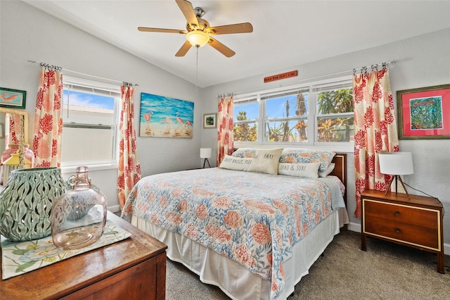 carpeted bedroom featuring a ceiling fan, baseboards, and lofted ceiling