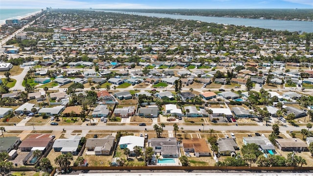 bird's eye view with a residential view and a water view