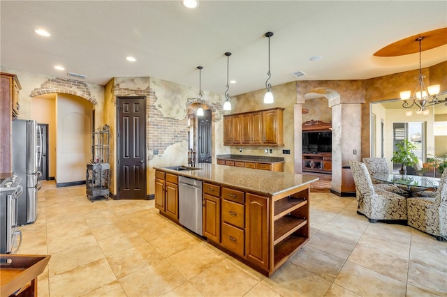 kitchen with visible vents, arched walkways, brown cabinets, a sink, and stainless steel appliances