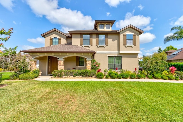 1703 Frogs Leap Ct, Port Orange, FL 32128 - view of front facade with stucco siding, a porch, a front lawn, and stone siding
